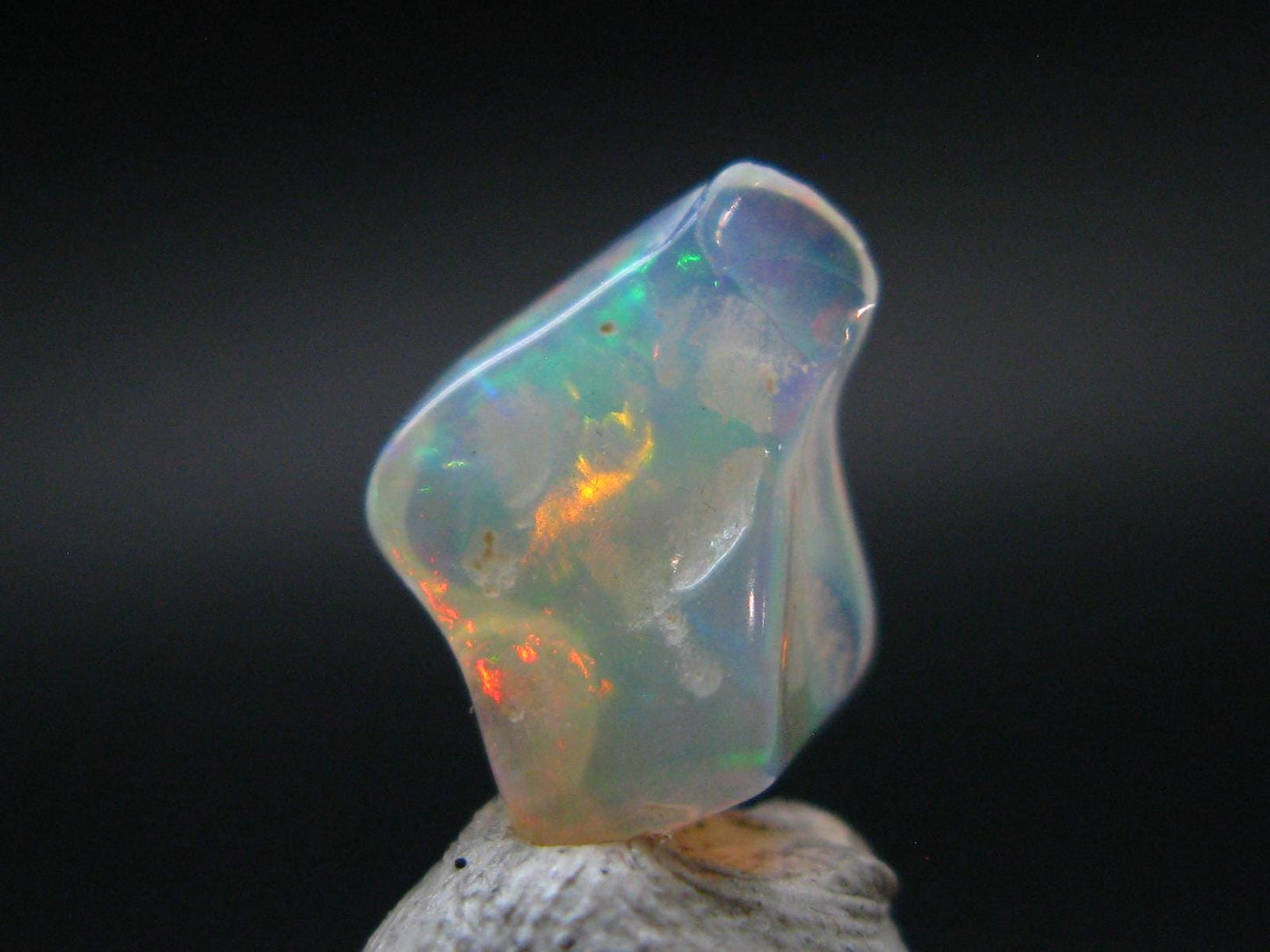 Natural Polished Opal With Play of Color from Ethiopia - 0.5" - 1.86 Carats
