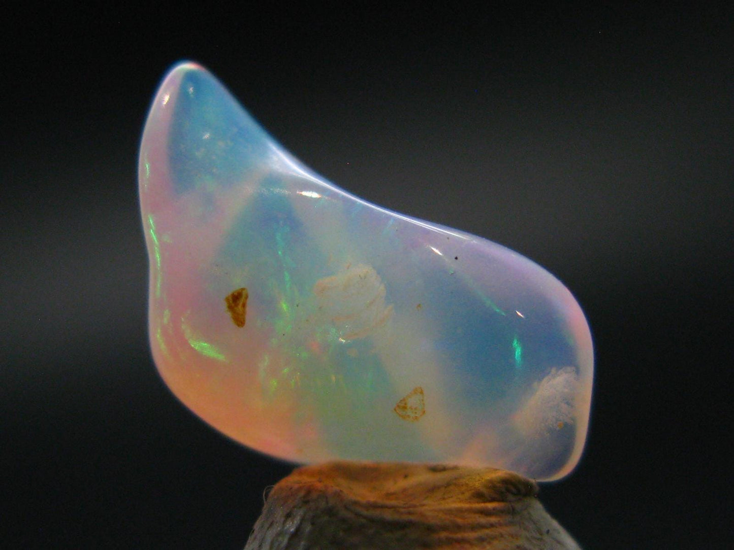 Natural Polished Opal With Play of Color from Ethiopia - 0.6" - 2.73 Carats