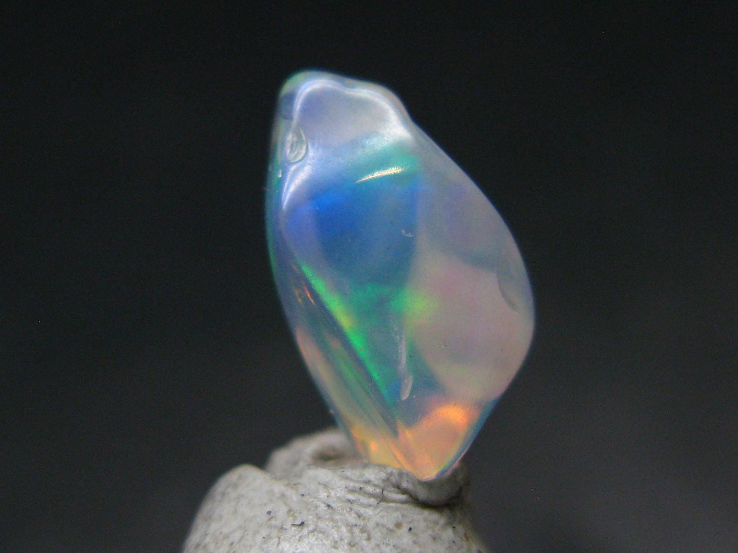 Natural Polished Opal With Play of Color from Ethiopia - 0.5" - 2.90 Carats