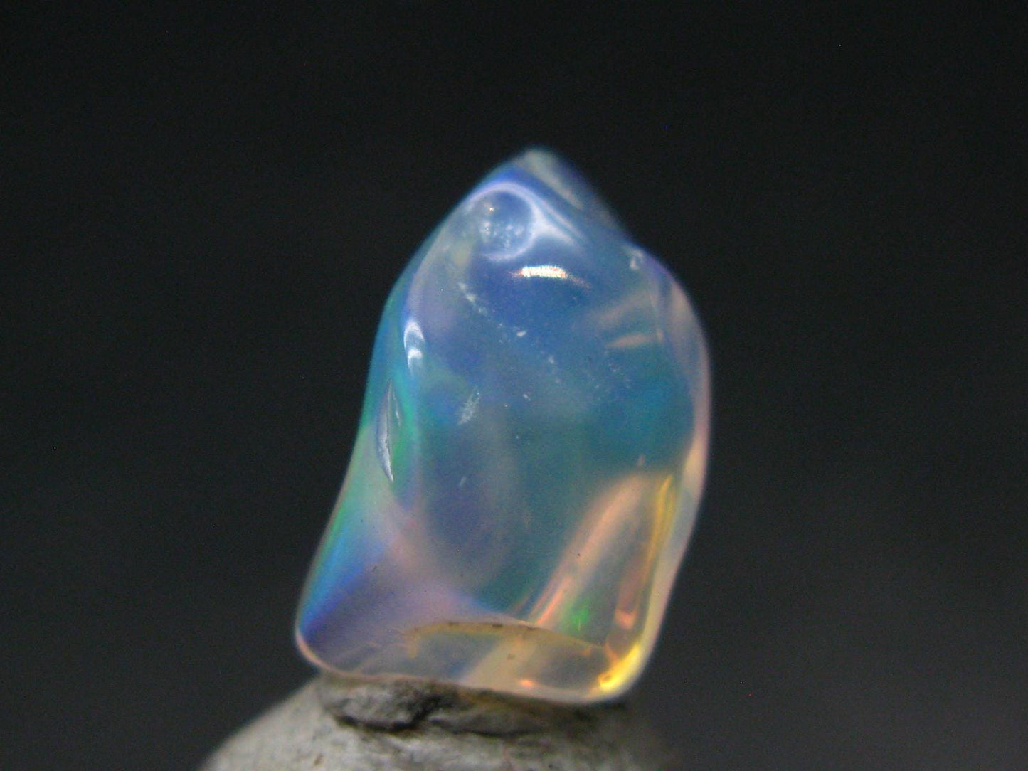 Natural Polished Opal With Play of Color from Ethiopia - 0.5" - 2.90 Carats