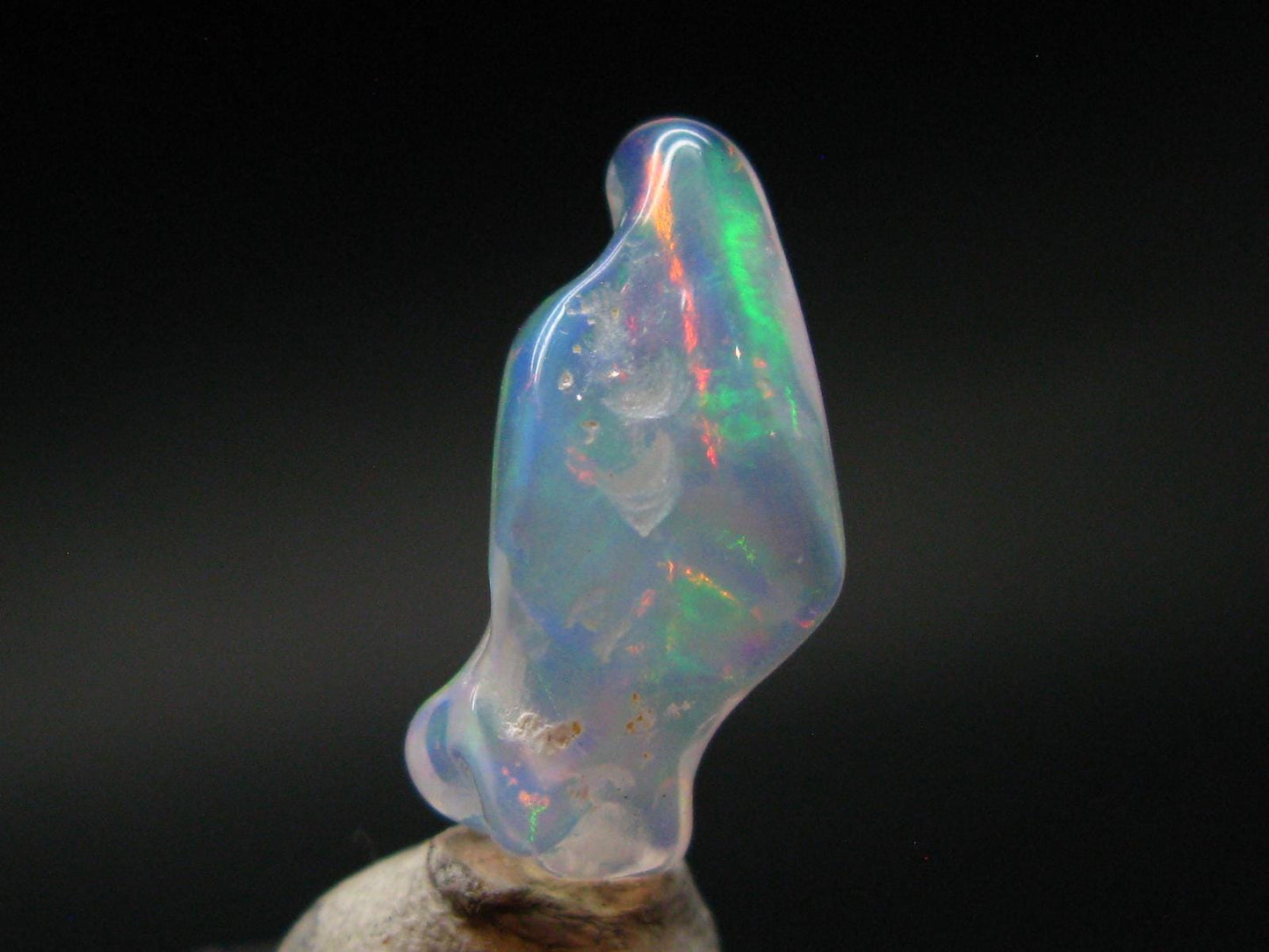 Natural Polished Opal With Play of Color from Ethiopia - 0.8" - 3.78 Carats