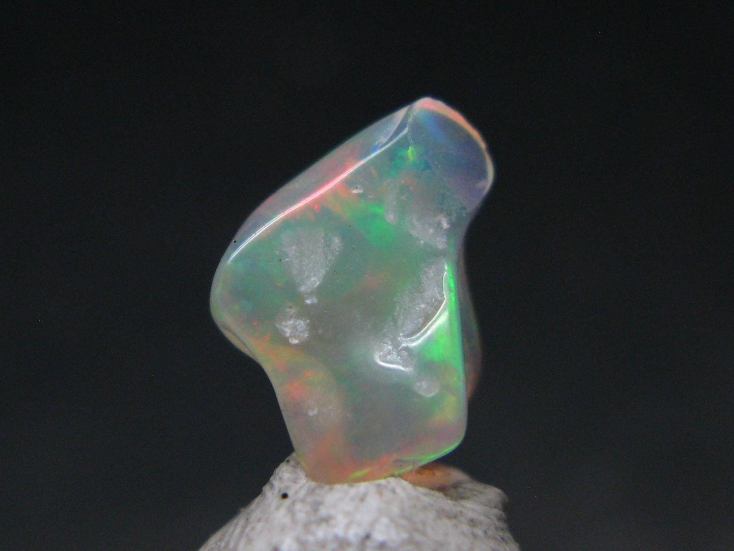 Natural Polished Opal With Play of Color from Ethiopia - 0.5" - 1.86 Carats