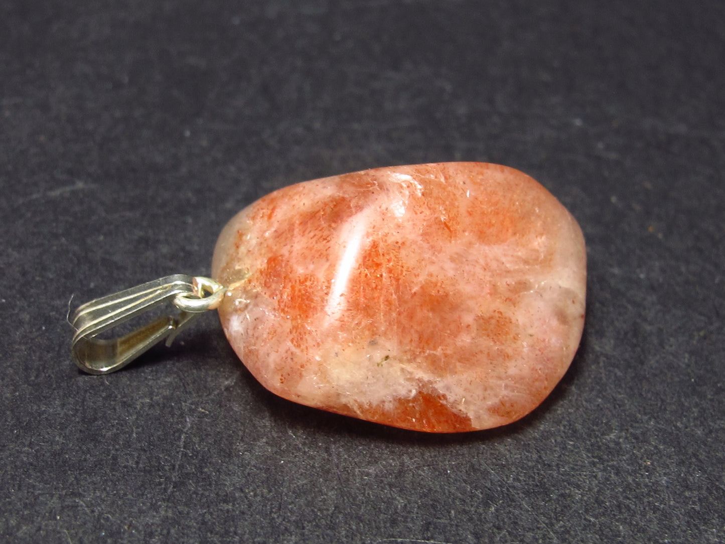 Tumbled Brightly Polished Sunstone Silver Pendant From Tanzania - 1.1"