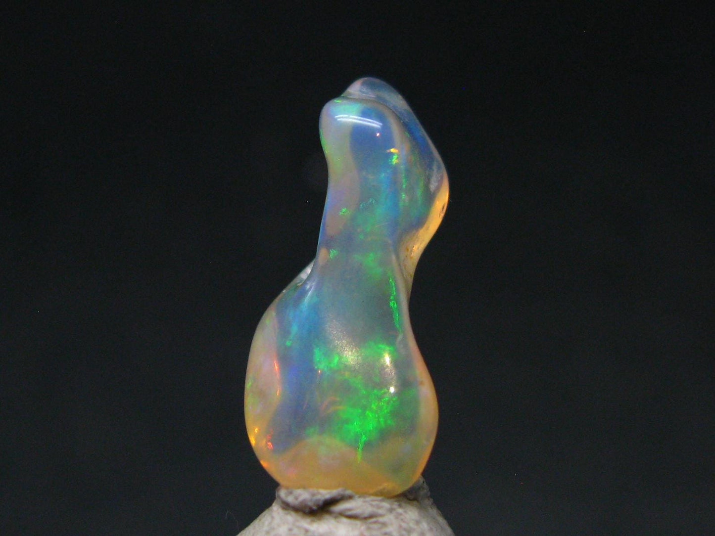 Natural Polished Opal With Play of Color from Ethiopia - 0.8" - 3.39 Carats