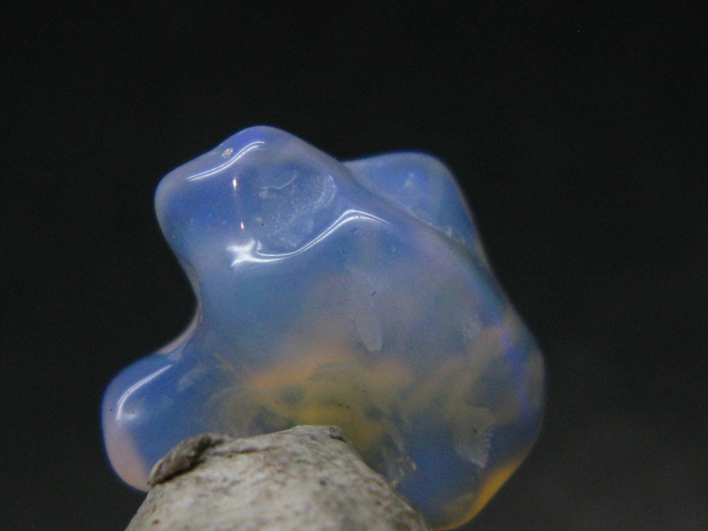 Natural Polished Opal With Play of Color from Ethiopia - 0.6" - 4.89 Carats