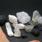Synergy 12 Set Phenakite Moldavite Natrolite Petalite Danburite Tektite Scolecite Herderite Tanzanite Brookite 111.0 Gr