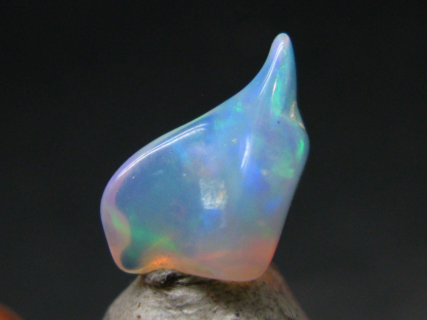 Natural Polished Opal With Play of Color from Ethiopia - 0.6" - 2.73 Carats