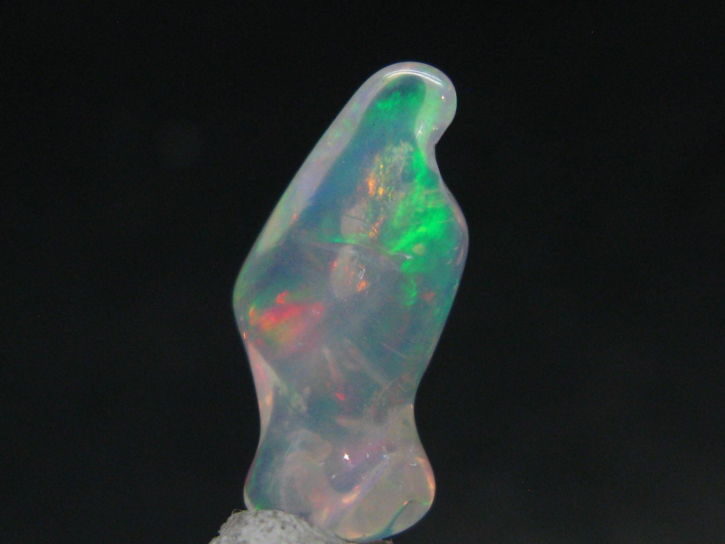 Natural Polished Opal With Play of Color from Ethiopia - 0.8" - 3.78 Carats
