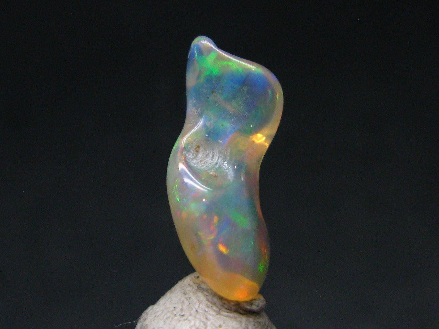 Natural Polished Opal With Play of Color from Ethiopia - 0.8" - 3.39 Carats