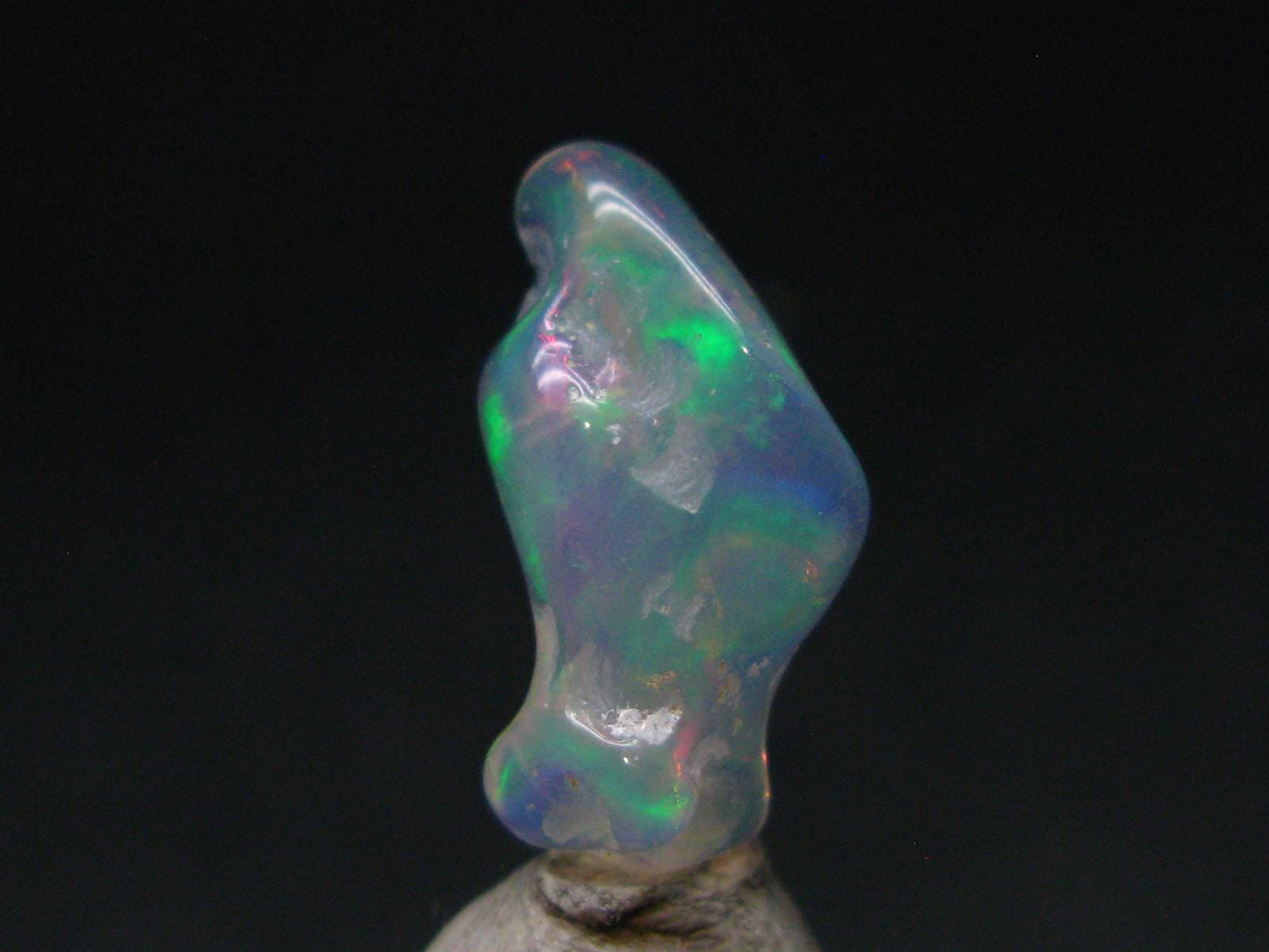 Natural Polished Opal With Play of Color from Ethiopia - 0.8" - 3.78 Carats