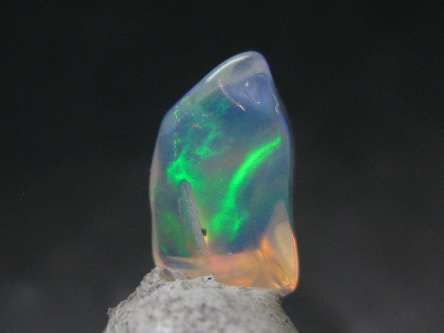 Natural Polished Opal With Play of Color from Ethiopia - 0.5" - 2.90 Carats