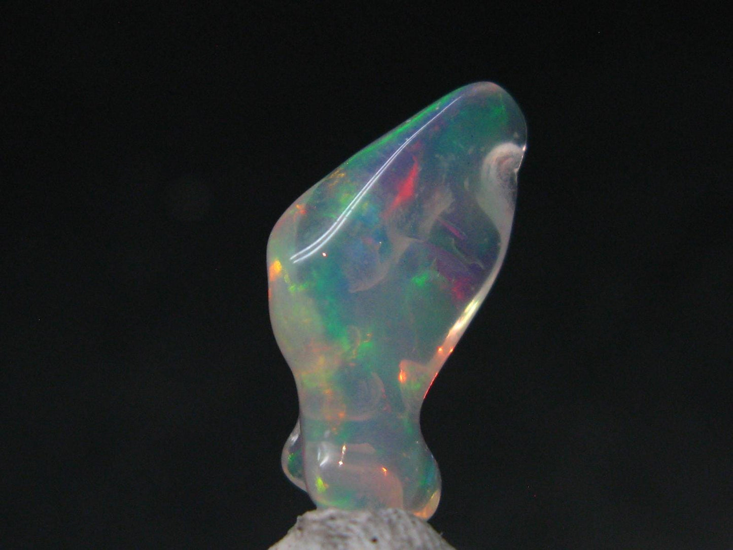 Natural Polished Opal With Play of Color from Ethiopia - 0.8" - 3.78 Carats