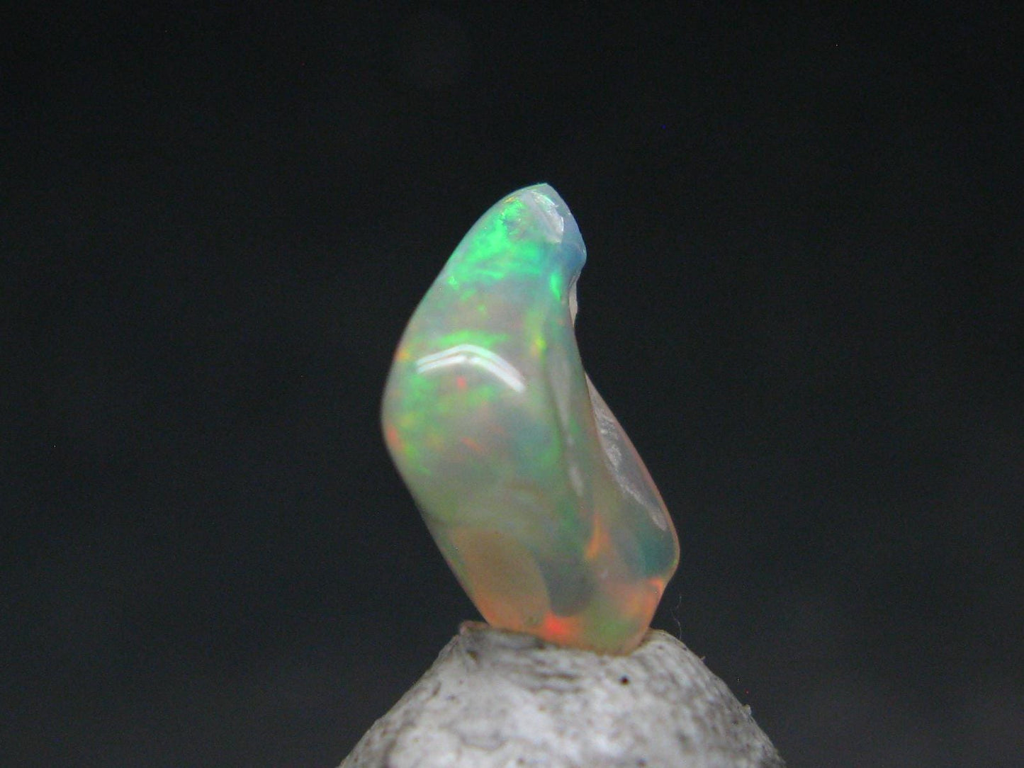 Natural Polished Opal With Play of Color from Ethiopia - 0.5" - 1.86 Carats