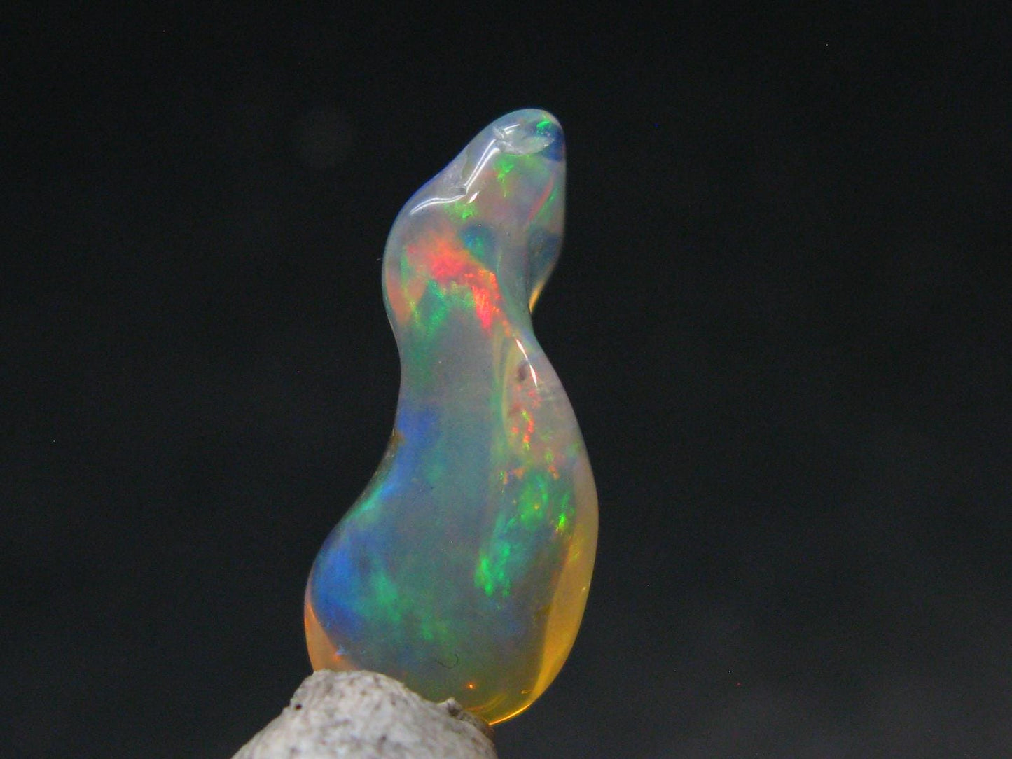 Natural Polished Opal With Play of Color from Ethiopia - 0.8" - 3.39 Carats