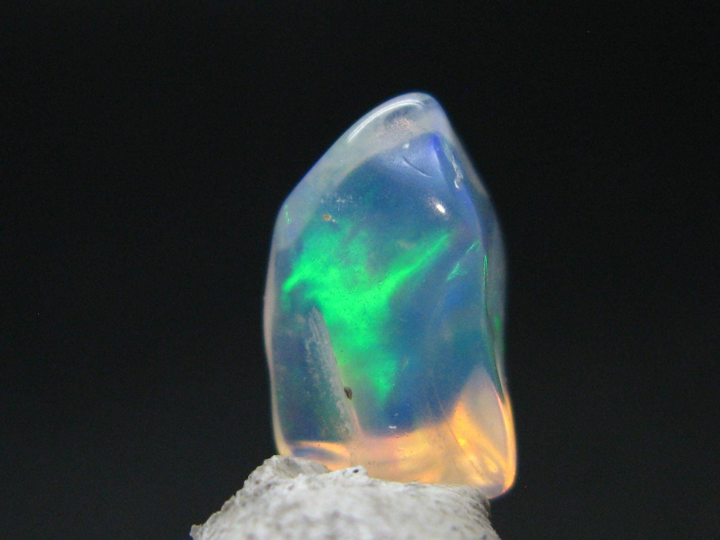 Natural Polished Opal With Play of Color from Ethiopia - 0.5" - 2.90 Carats