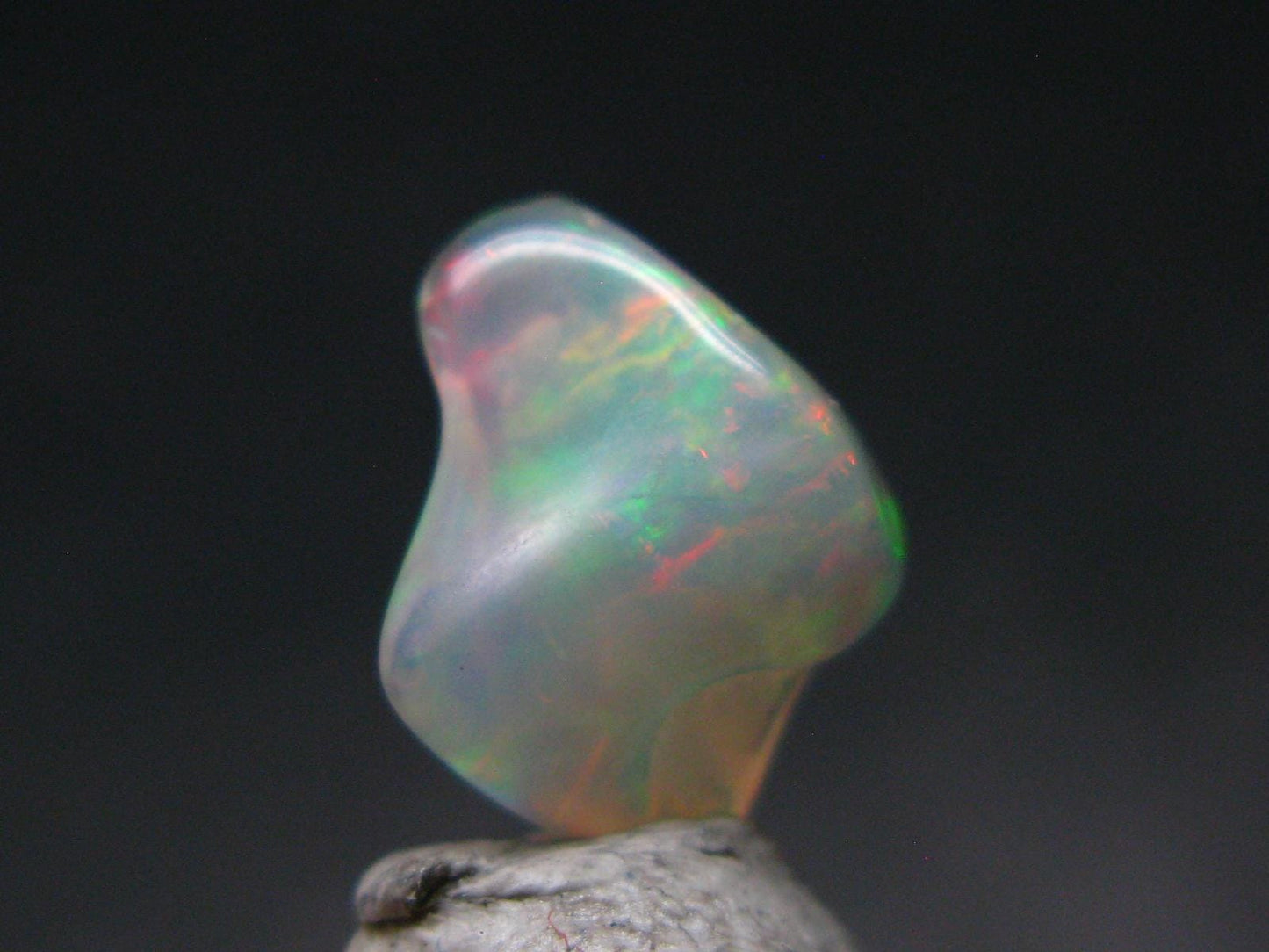 Natural Polished Opal With Play of Color from Ethiopia - 0.5" - 1.86 Carats