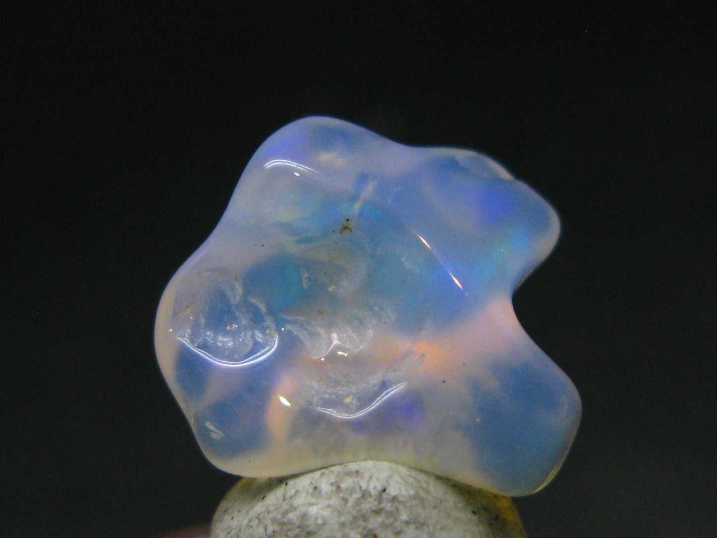 Natural Polished Opal With Play of Color from Ethiopia - 0.6" - 4.89 Carats