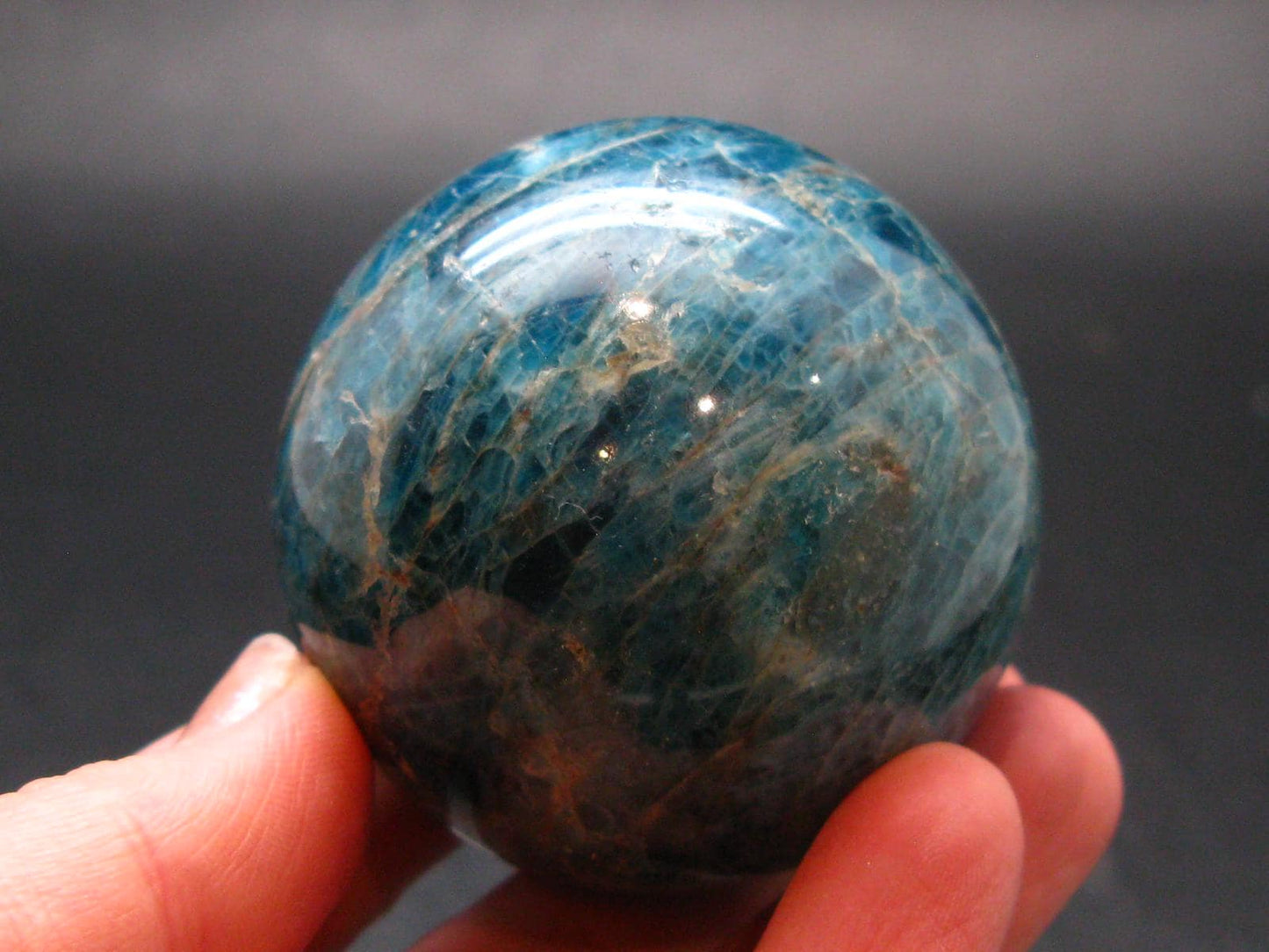 Large neon blue Apatite sphere from Madagascar- 212.68 - 1.9"