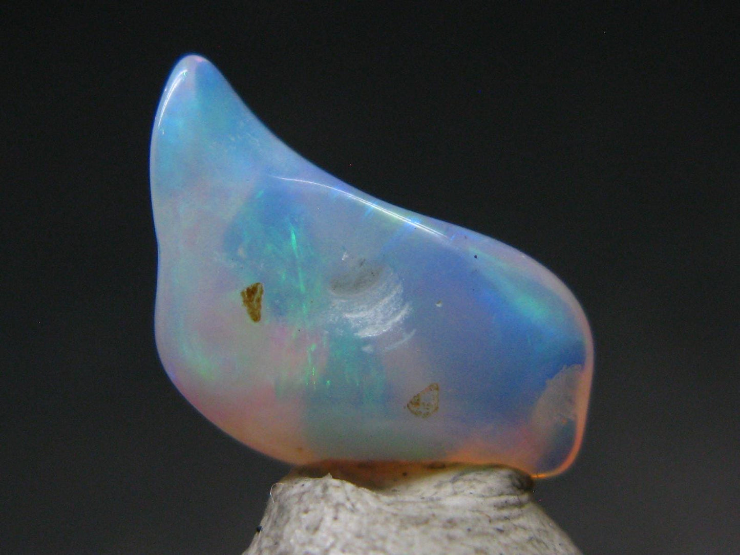 Natural Polished Opal With Play of Color from Ethiopia - 0.6" - 2.73 Carats