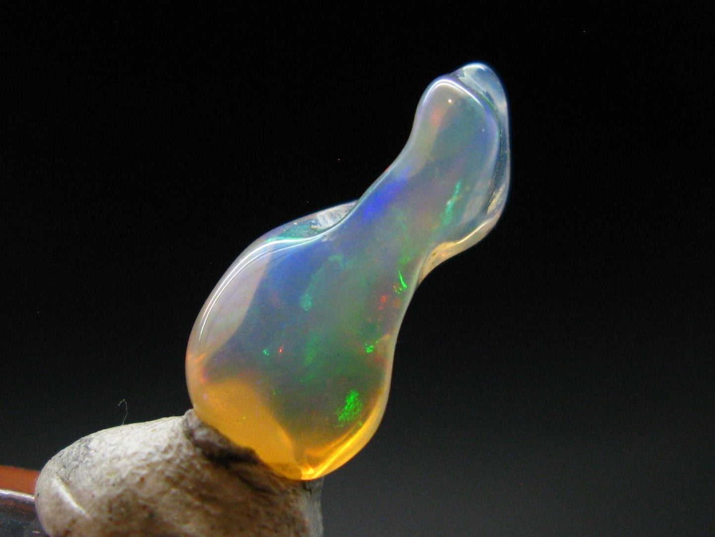 Natural Polished Opal With Play of Color from Ethiopia - 0.8" - 3.39 Carats